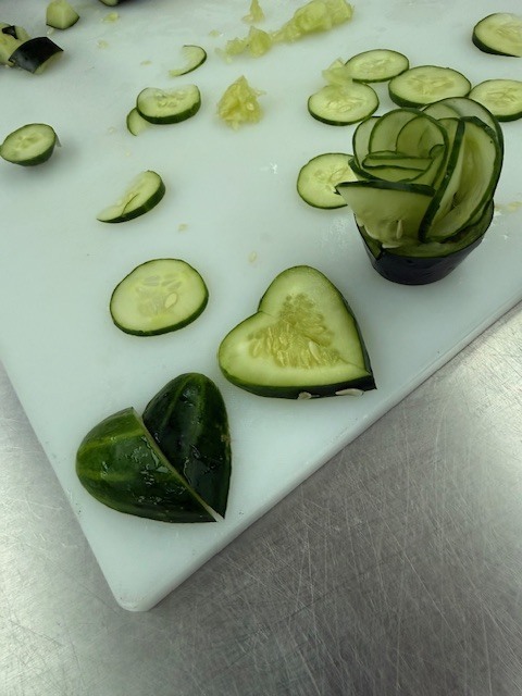 Students in Culinary 3 and 4 are sharpening their culinary artistry while learning garnishing and decorative food presentation. As part of the lesson, students practiced transforming cucumbers into delicate flower designs, building both knife skills and attention to detail. Activities like this help our Panthers understand that presentation is just as important as flavor in the culinary world while allowing them to showcase their creativity in the kitchen.