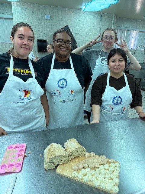 Our Culinary 3 and 4 students recently took on the challenge of creating their own bread-and-butter boards from scratch! Students began by researching a bread recipe that could be completed within two days. On day one, they prepared the dough and placed it in the refrigerator to slow the rise. On day two, they shaped and baked their loaves, then created a flavored butter of their choice. From sweet to savory, the variety of butters paired perfectly with the freshly baked bread. To finish, students arranged their creations on wooden cutting boards for a beautiful presentation. It was a hands-on lesson in patience, technique, and creativity, and the results were delicious! 