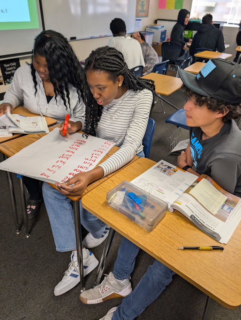 Students in Ms. Henning’s ELD Reading class strengthened their language skills through an engaging vocabulary challenge. Using a list of specific consonants they had studied along with all vowels, students worked in teams to create as many words as possible using only those letters. The classroom quickly turned into a lively competition as groups collaborated, experimented with different letter combinations, and celebrated each new word they discovered. This activity helped students apply their phonics knowledge, expand their vocabulary, and build confidence as they worked together in a fun, supportive learning environment.