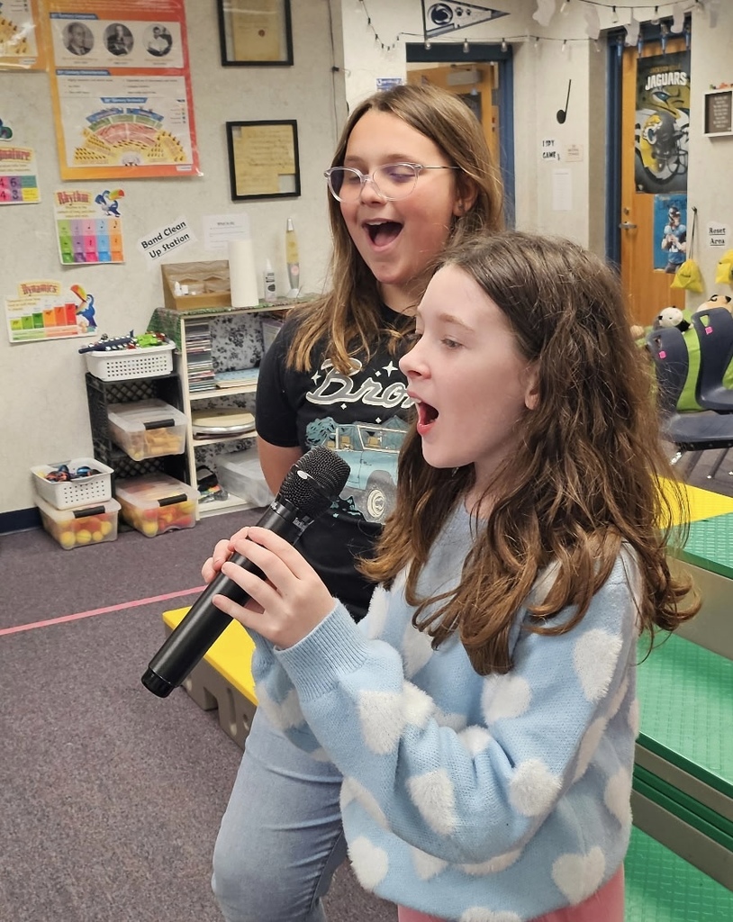 students singing under the direction of Mr. Rivera