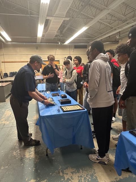 Our world history students had the opportunity to engage in a meaningful and impactful learning experience by exploring a traveling Holocaust cattle car exhibit and accompanying displays. Through scheduled small-group presentations in the cattle car, students experienced history in a powerful, personal way, while additional artifacts in the nearby classroom allowed for continued reflection and learning throughout the day. This experience helped bring their studies to life and deepened their understanding of the human impact of historical events.    A special thank you to Ms. Ryan, whose effort and coordination made this experience possible for our students. Because of her dedication, our students were able to connect classroom learning to real-world history in ways that foster empathy, awareness, and lasting perspective.