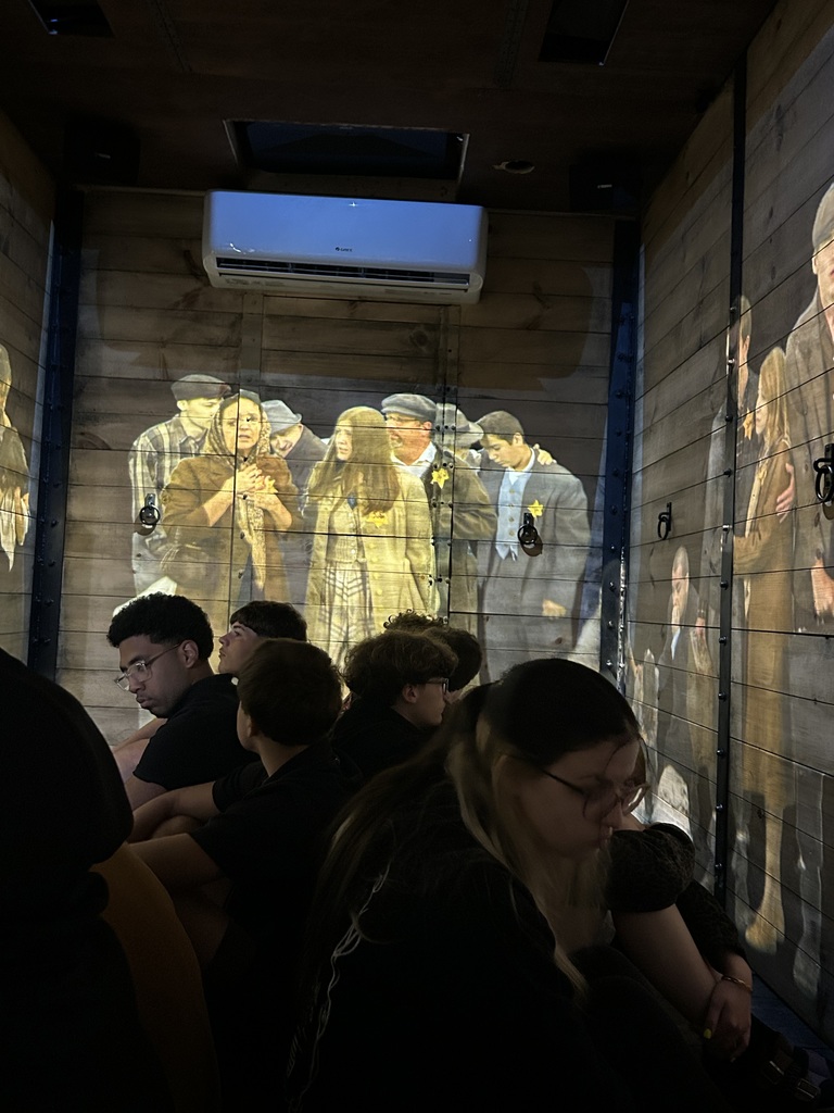 Our world history students had the opportunity to engage in a meaningful and impactful learning experience by exploring a traveling Holocaust cattle car exhibit and accompanying displays. Through scheduled small-group presentations in the cattle car, students experienced history in a powerful, personal way, while additional artifacts in the nearby classroom allowed for continued reflection and learning throughout the day. This experience helped bring their studies to life and deepened their understanding of the human impact of historical events.    A special thank you to Ms. Ryan, whose effort and coordination made this experience possible for our students. Because of her dedication, our students were able to connect classroom learning to real-world history in ways that foster empathy, awareness, and lasting perspective.