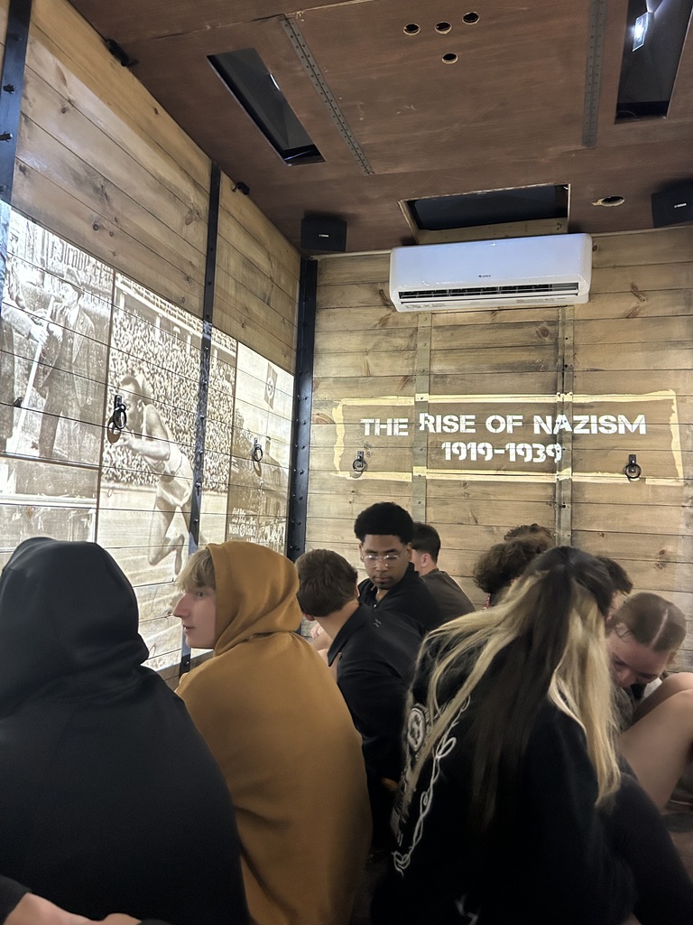 Our world history students had the opportunity to engage in a meaningful and impactful learning experience by exploring a traveling Holocaust cattle car exhibit and accompanying displays. Through scheduled small-group presentations in the cattle car, students experienced history in a powerful, personal way, while additional artifacts in the nearby classroom allowed for continued reflection and learning throughout the day. This experience helped bring their studies to life and deepened their understanding of the human impact of historical events.    A special thank you to Ms. Ryan, whose effort and coordination made this experience possible for our students. Because of her dedication, our students were able to connect classroom learning to real-world history in ways that foster empathy, awareness, and lasting perspective.