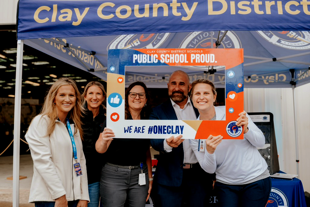Photo at the CCDS Fair Booth with State and District Leaders