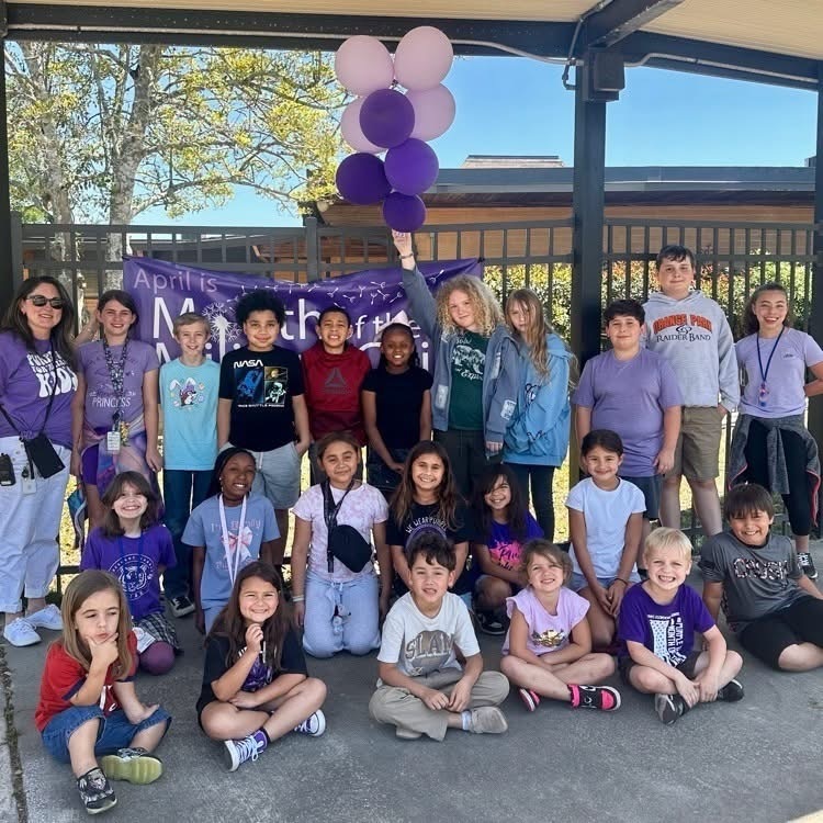 Staff and Students wearing purple to support military students.