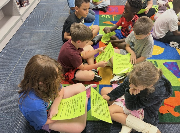 Photo of students reading in groups
