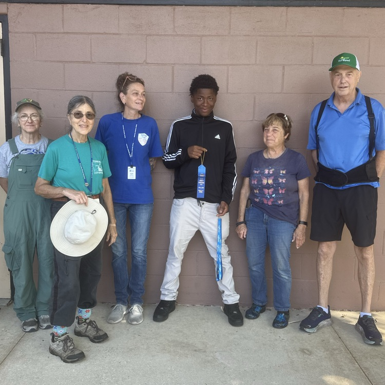 Students standing with the master gardeners with their awards from the Clay County Fair.