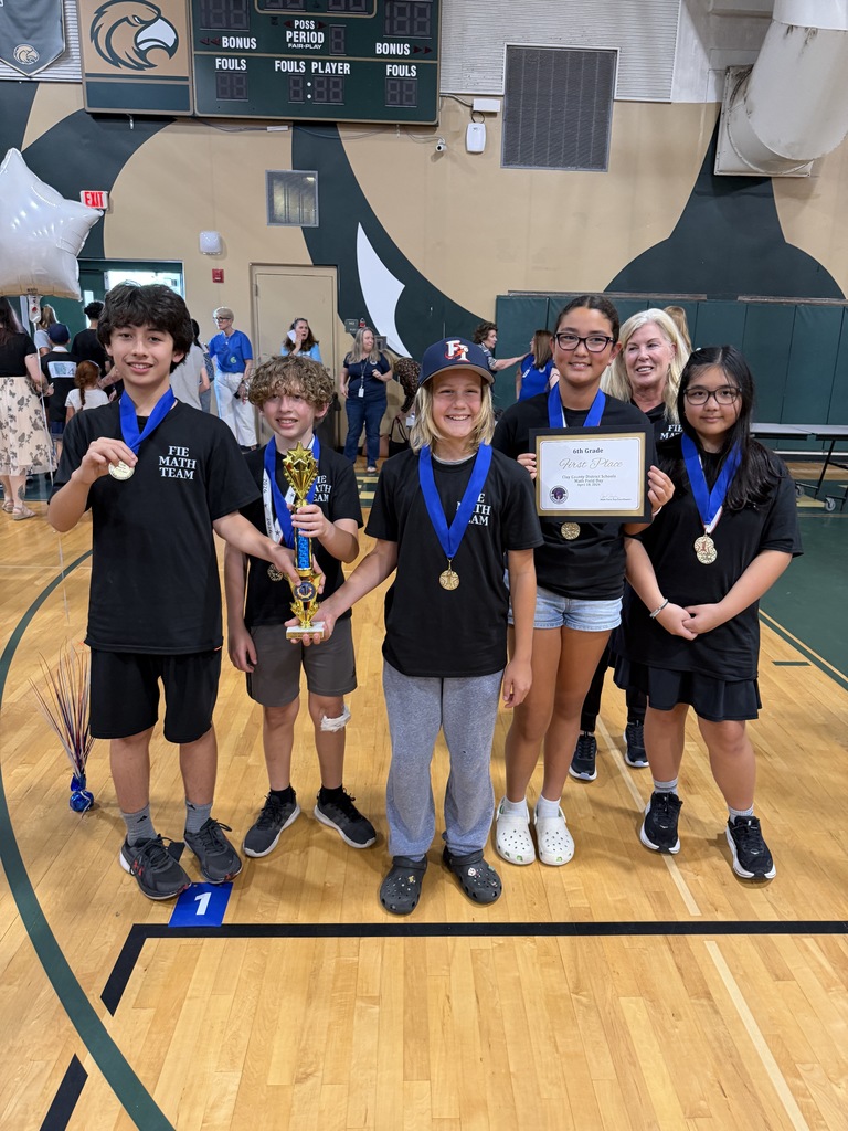 Students and Staff with Awards and Trophies