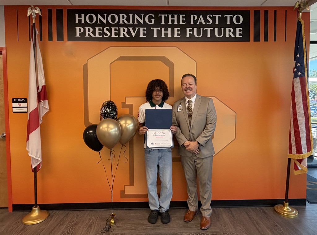Student with Award and Superintendent