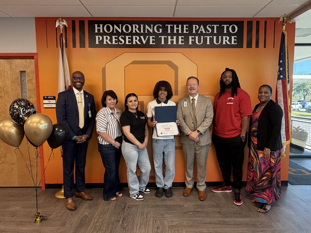 Student with Award and Family and Staff