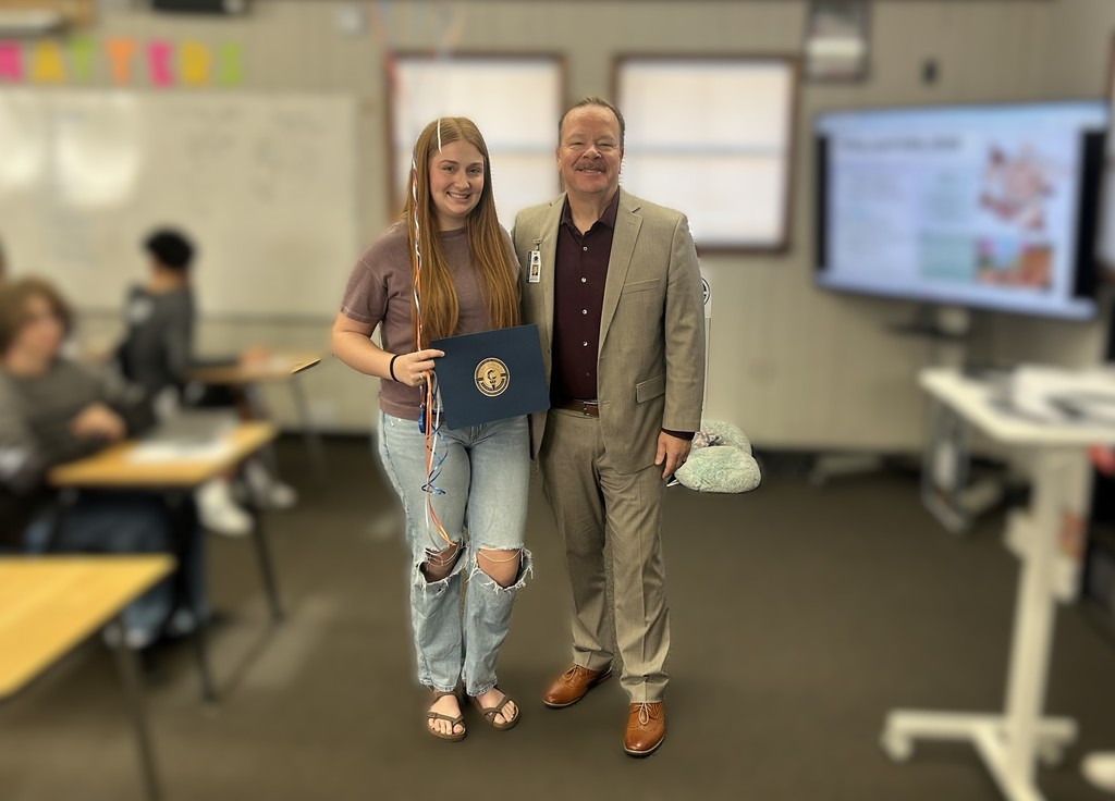 Student with Award and Superintendent