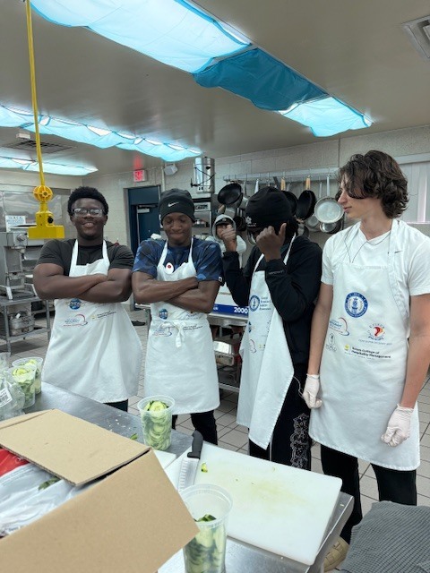 Recently, our Culinary students worked hard to prepare an incredible meal for the Clay Can Dance event. Students pounded out 250 pieces of chicken, and Mrs. Stevens’ 3rd period was a tremendous help during the preparation process while many students were away at Grad Bash.  The menu featured rolled chicken stuffed with spinach and Boursin cheese, Caprese skewers, salad, green beans, meatballs, bruschetta, molded butter, and mashed potatoes. A special thank you goes to Angelica, Mariah, and Sidney, who came in on Saturday to help finish the meal and prepare the mashed potatoes for pick up.  We are proud of the teamwork, dedication, and talent our students demonstrated, and we are so glad the guests enjoyed the meal.