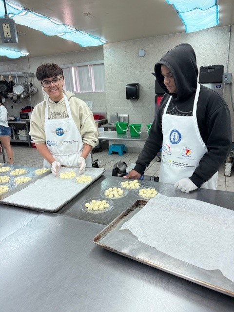 Recently, our Culinary students worked hard to prepare an incredible meal for the Clay Can Dance event. Students pounded out 250 pieces of chicken, and Mrs. Stevens’ 3rd period was a tremendous help during the preparation process while many students were away at Grad Bash.  The menu featured rolled chicken stuffed with spinach and Boursin cheese, Caprese skewers, salad, green beans, meatballs, bruschetta, molded butter, and mashed potatoes. A special thank you goes to Angelica, Mariah, and Sidney, who came in on Saturday to help finish the meal and prepare the mashed potatoes for pick up.  We are proud of the teamwork, dedication, and talent our students demonstrated, and we are so glad the guests enjoyed the meal.