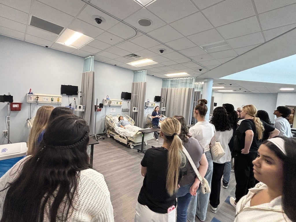 Our Health Science and HOSA students had a fantastic visit to the University of North Florida today. Faculty from the Brooks College of Health introduced students to the many degree programs available and shared valuable insight into careers in the healthcare field. Students also participated in a question and answer session with professors and senior nursing students, giving them a firsthand look at college life, coursework, and future opportunities. After the presentation, students enjoyed a guided walking tour of campus followed by lunch at the Osprey Café. The group then traveled to the MedNexus Simulation Lab at Deerwood, where they explored high fidelity mannequins used in medical training and practiced skills such as performing CPR, placing an NG tube, checking a pulse, and other hands on activities. It was an incredible experience that allowed students to see the pathways and possibilities waiting for them after high school.