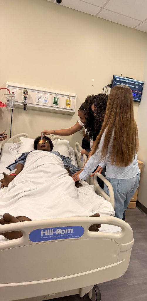 Our Health Science and HOSA students had a fantastic visit to the University of North Florida today. Faculty from the Brooks College of Health introduced students to the many degree programs available and shared valuable insight into careers in the healthcare field. Students also participated in a question and answer session with professors and senior nursing students, giving them a firsthand look at college life, coursework, and future opportunities. After the presentation, students enjoyed a guided walking tour of campus followed by lunch at the Osprey Café. The group then traveled to the MedNexus Simulation Lab at Deerwood, where they explored high fidelity mannequins used in medical training and practiced skills such as performing CPR, placing an NG tube, checking a pulse, and other hands on activities. It was an incredible experience that allowed students to see the pathways and possibilities waiting for them after high school.