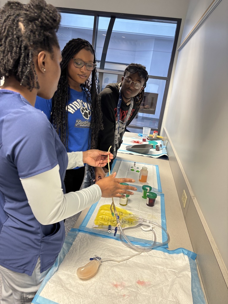 Our Health Science and HOSA students had a fantastic visit to the University of North Florida today. Faculty from the Brooks College of Health introduced students to the many degree programs available and shared valuable insight into careers in the healthcare field. Students also participated in a question and answer session with professors and senior nursing students, giving them a firsthand look at college life, coursework, and future opportunities. After the presentation, students enjoyed a guided walking tour of campus followed by lunch at the Osprey Café. The group then traveled to the MedNexus Simulation Lab at Deerwood, where they explored high fidelity mannequins used in medical training and practiced skills such as performing CPR, placing an NG tube, checking a pulse, and other hands on activities. It was an incredible experience that allowed students to see the pathways and possibilities waiting for them after high school.