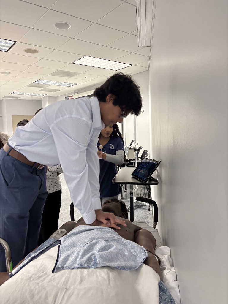 Our Health Science and HOSA students had a fantastic visit to the University of North Florida today. Faculty from the Brooks College of Health introduced students to the many degree programs available and shared valuable insight into careers in the healthcare field. Students also participated in a question and answer session with professors and senior nursing students, giving them a firsthand look at college life, coursework, and future opportunities. After the presentation, students enjoyed a guided walking tour of campus followed by lunch at the Osprey Café. The group then traveled to the MedNexus Simulation Lab at Deerwood, where they explored high fidelity mannequins used in medical training and practiced skills such as performing CPR, placing an NG tube, checking a pulse, and other hands on activities. It was an incredible experience that allowed students to see the pathways and possibilities waiting for them after high school.
