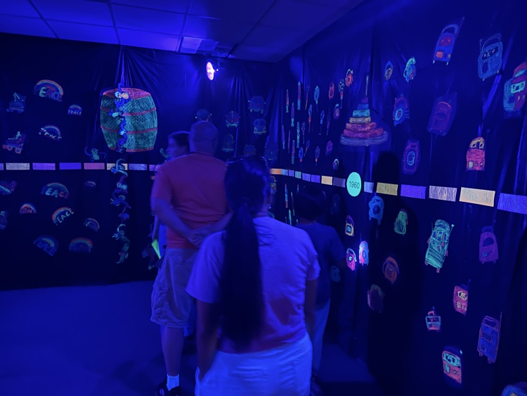 guests at art show glow room