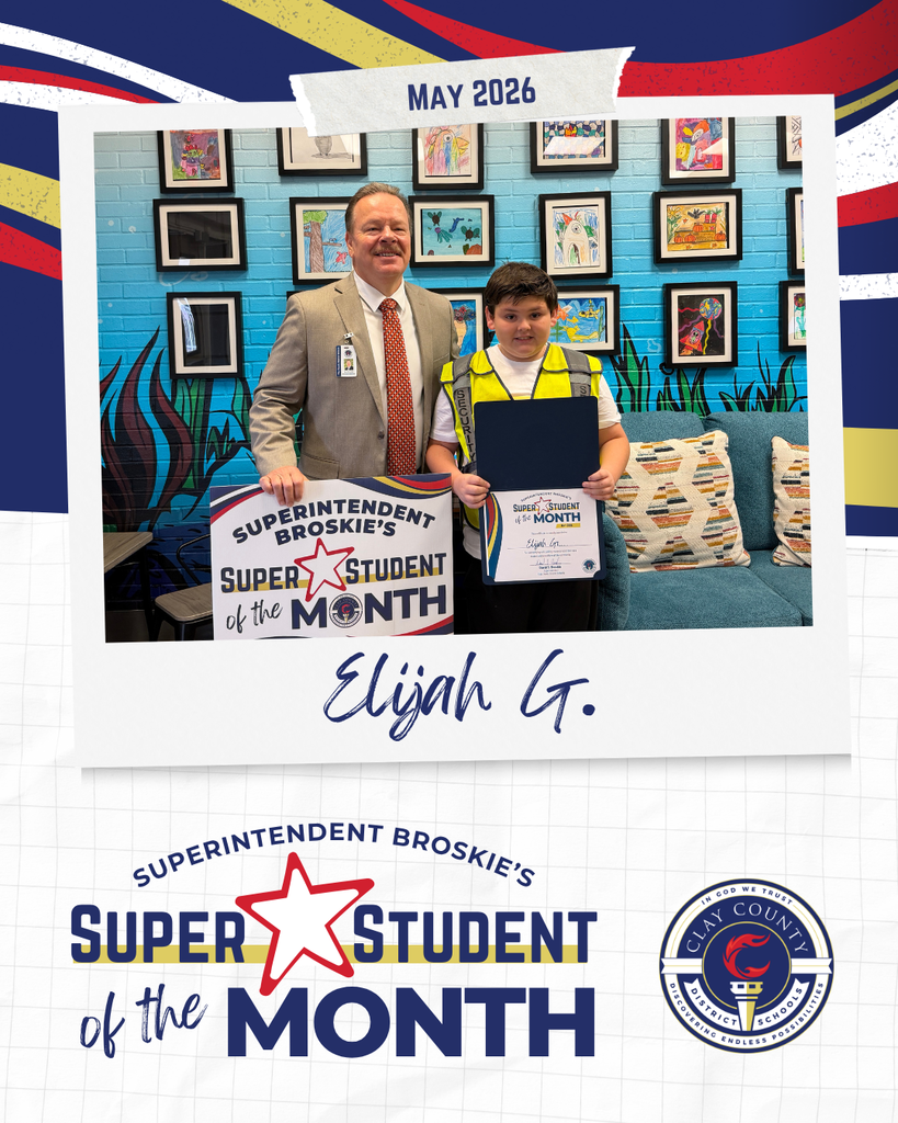 Two individuals stand with a certificate. The boy holds a certificate that says Student of the Month.
