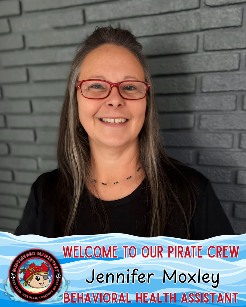 A woman in red glasses, smiling, stands against a gray brick wall. She wears a black shirt and a necklace. Text reads, "Welcome to our Pirate Crew Jennifer Moxley, Behavioral Health Assistant."