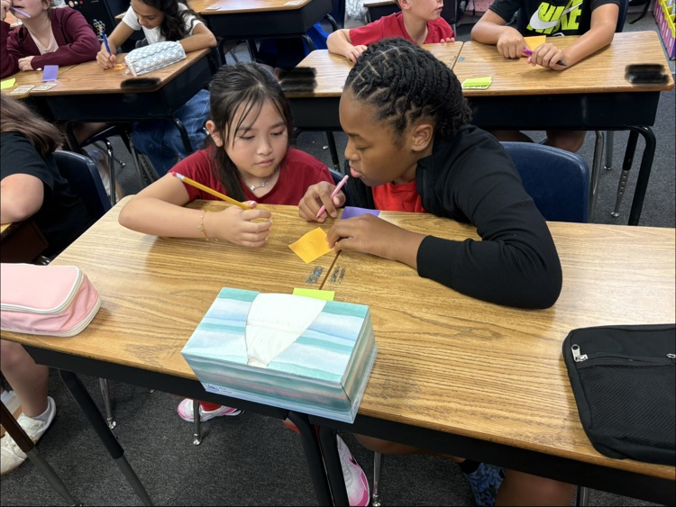 miss Myers class working on a writing project
