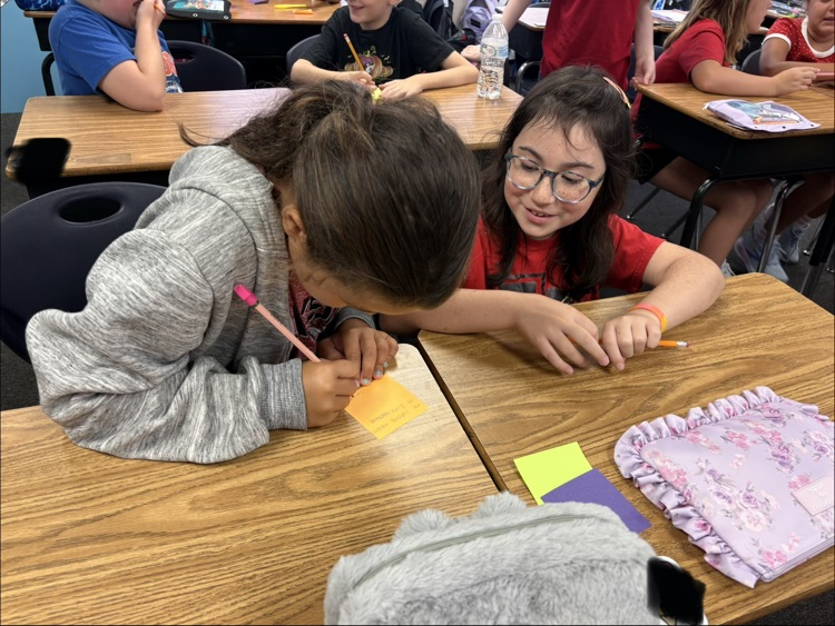 miss Myers class working on a writing project