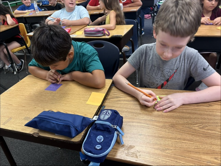 miss Myers class working on a writing project