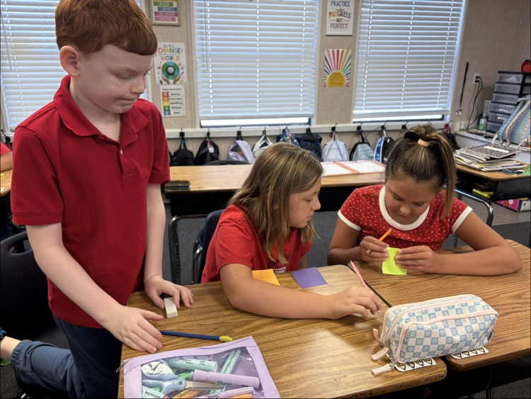 miss Myers class working on a writing project