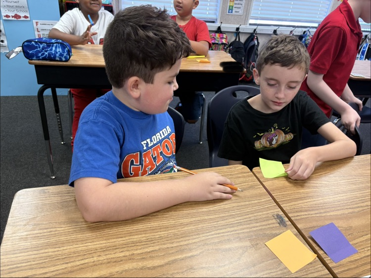mrs. Myers class working on a writing project