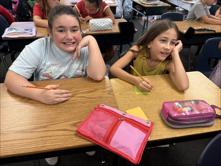 mrs. Myers class working on a writing project