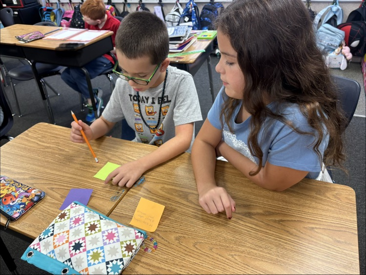 mrs. Myers class working on a writing project