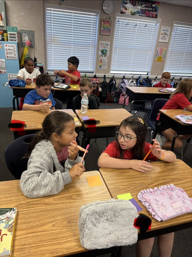 students in Mrs. Myers class working on a writing project
