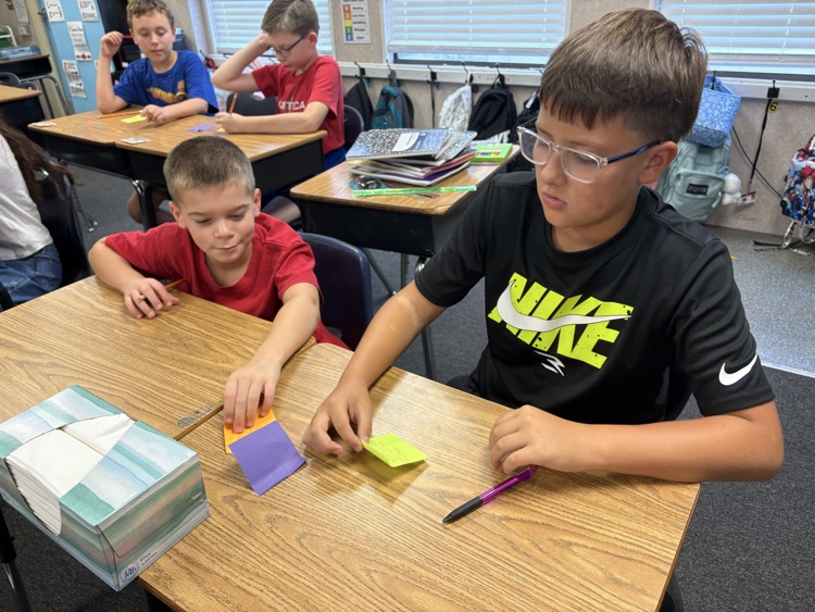 students in Mrs. Myers class working on a writing project