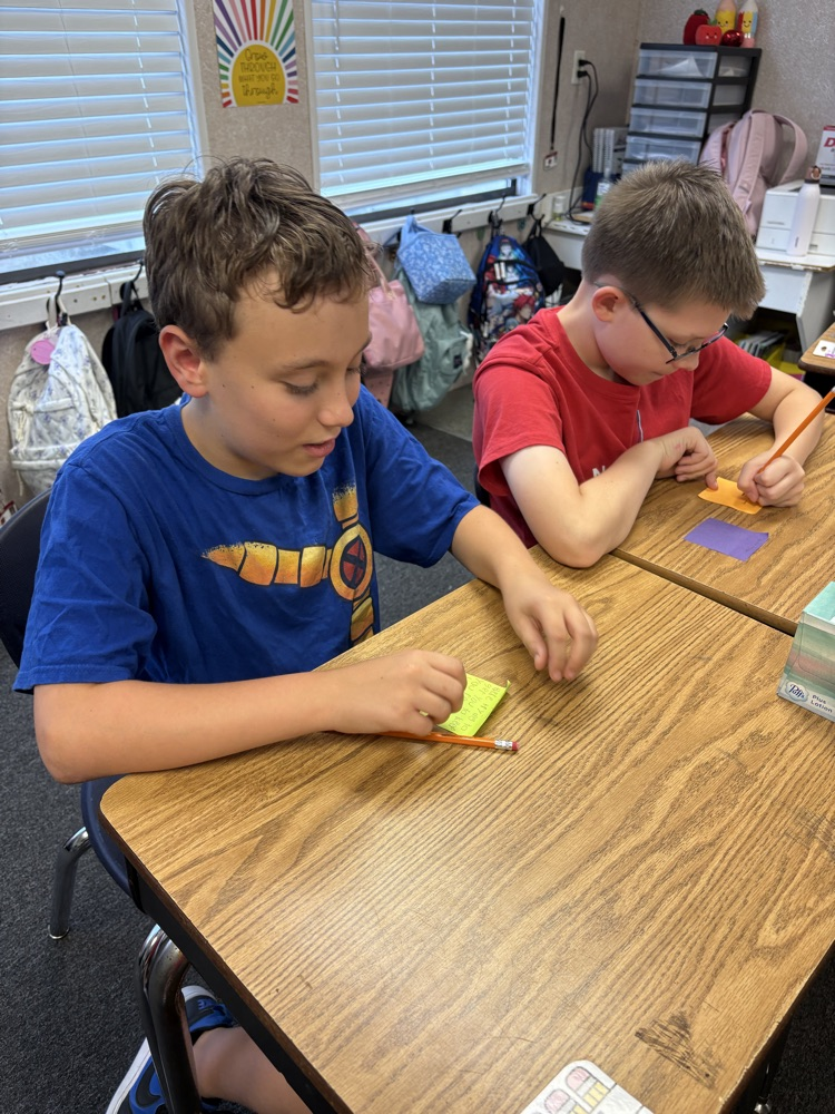 students in Mrs. Myers class working on a writing project