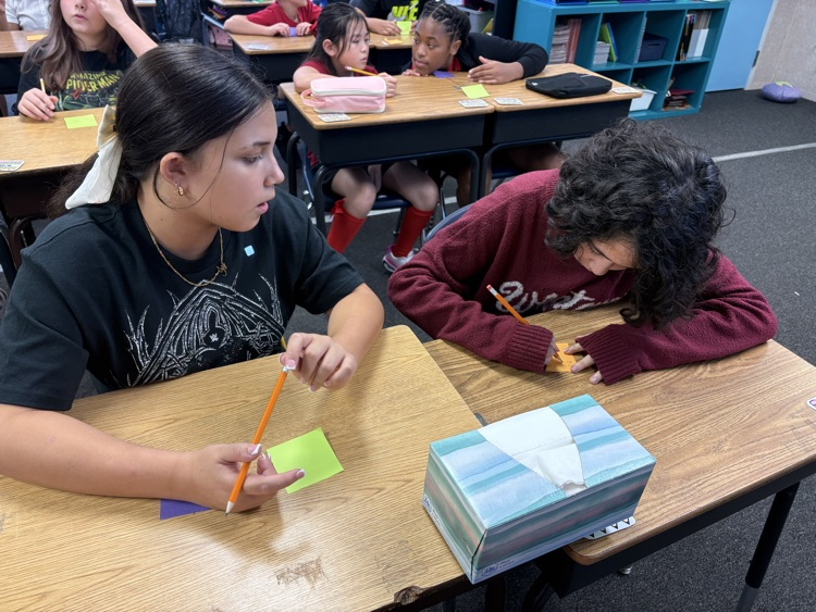 students in Mrs. Myers class working on a writing project