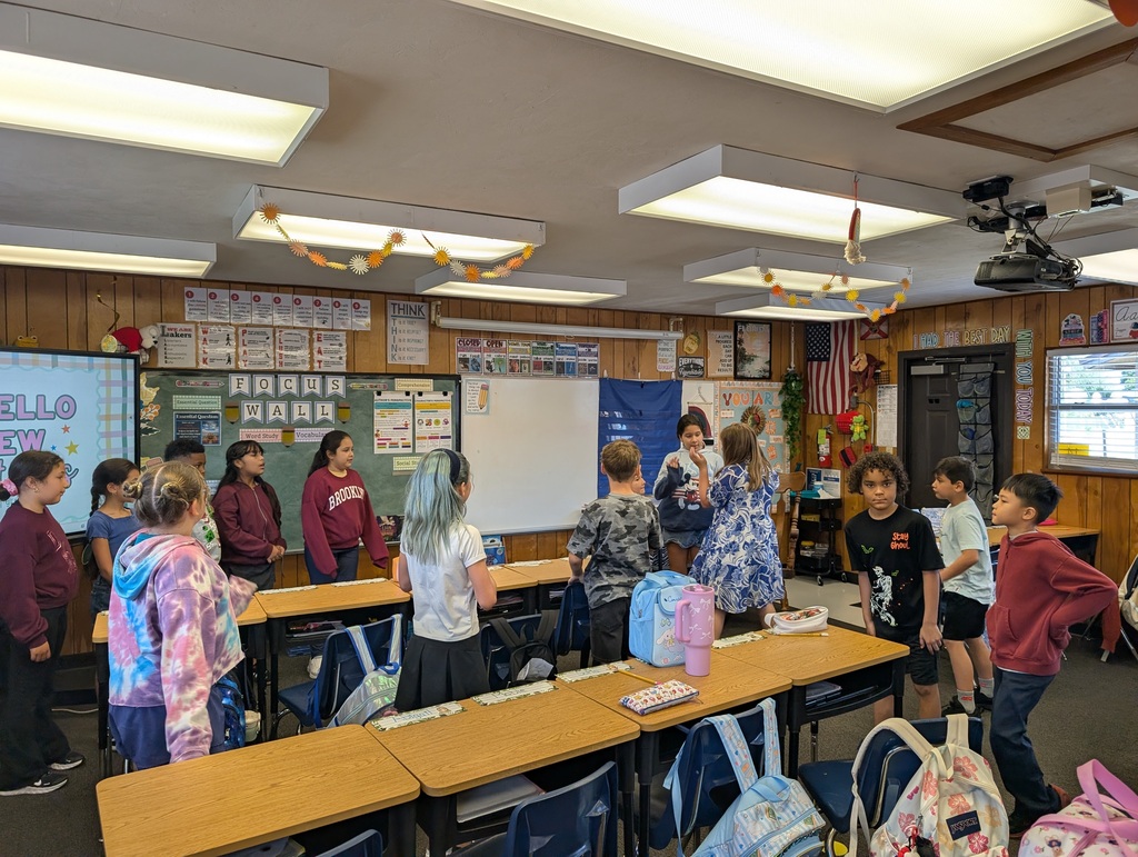 students working together to get into an organized line
