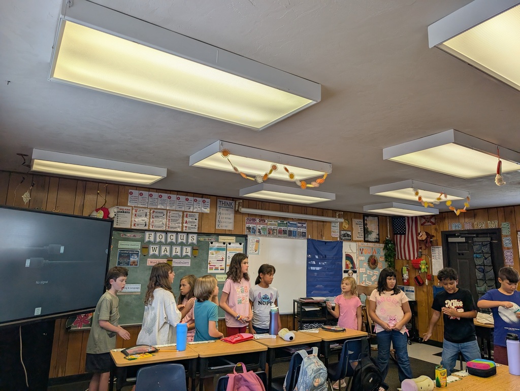 students working together to get into an organized line