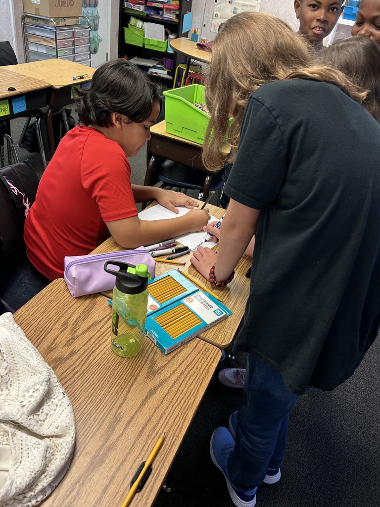 students presenting information to their class
