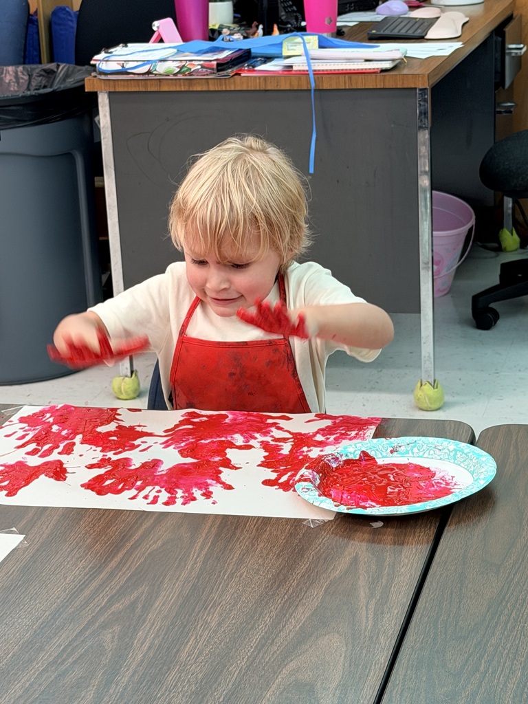 student painting a picture