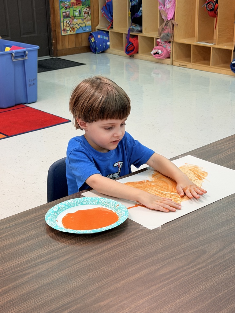 student painting a picture