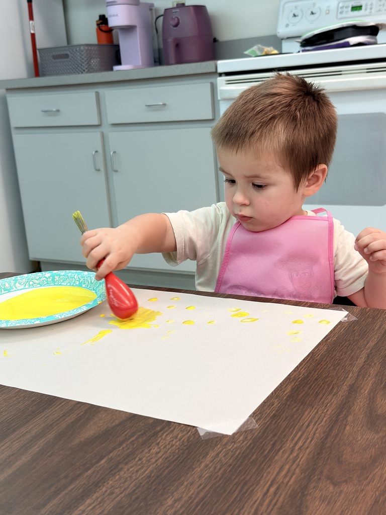 student painting a picture