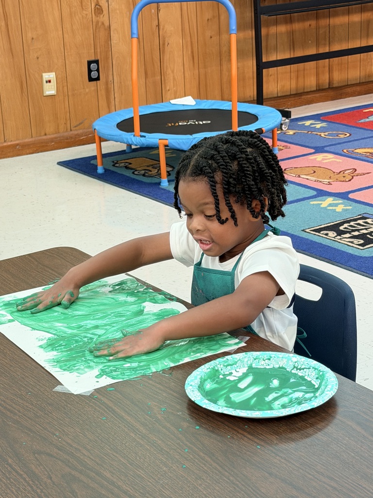 student painting a picture