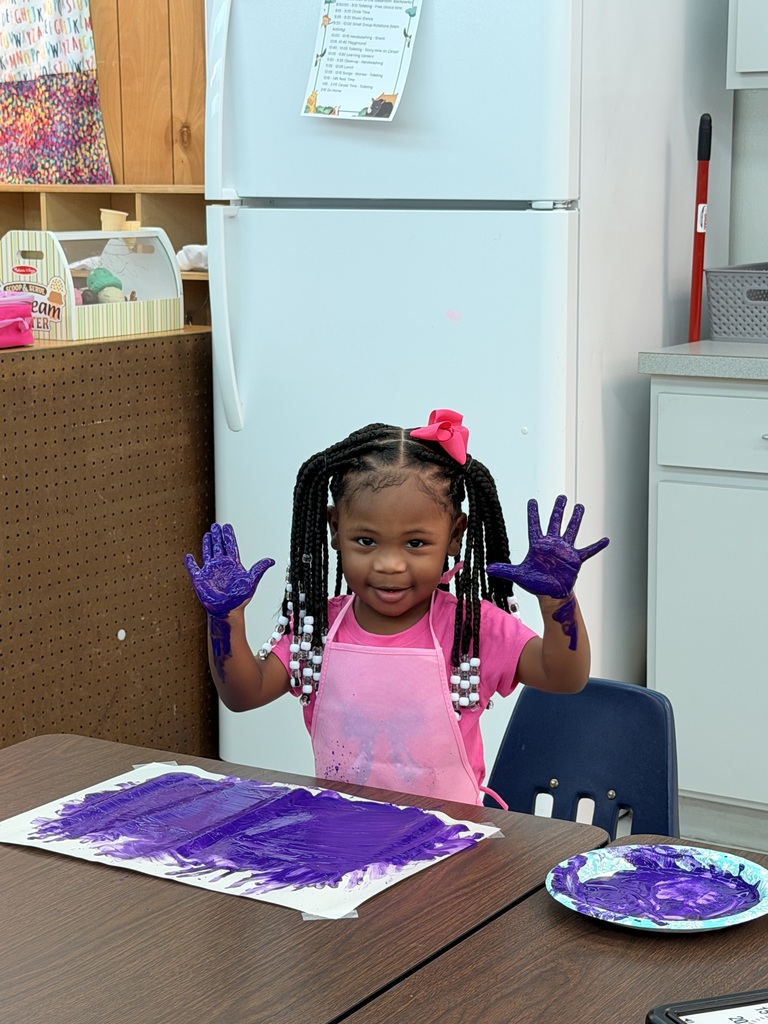 student painting a picture