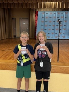 Students holding SOAR award