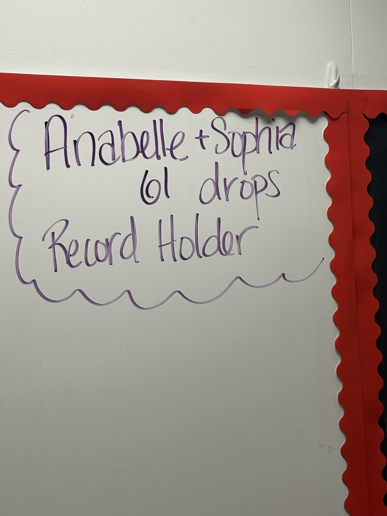 A white board with a red border. Purple writing on it reads "Anabbelle + Sophia 6th drops Record Holder."