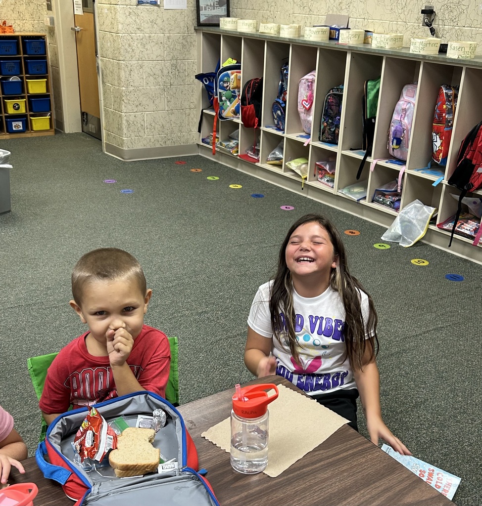 a student reading to another student