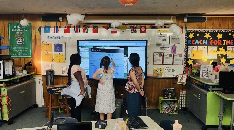 Students learning about measurement with hands-on learning 
