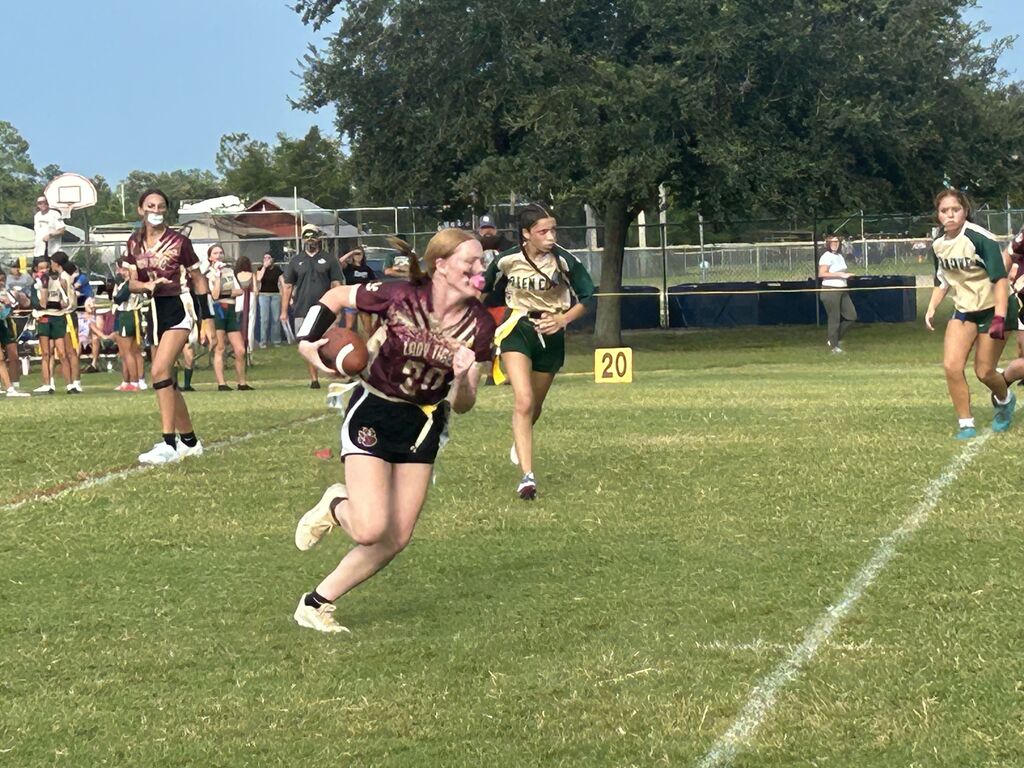 LAJH Flag Football Student Running with Football