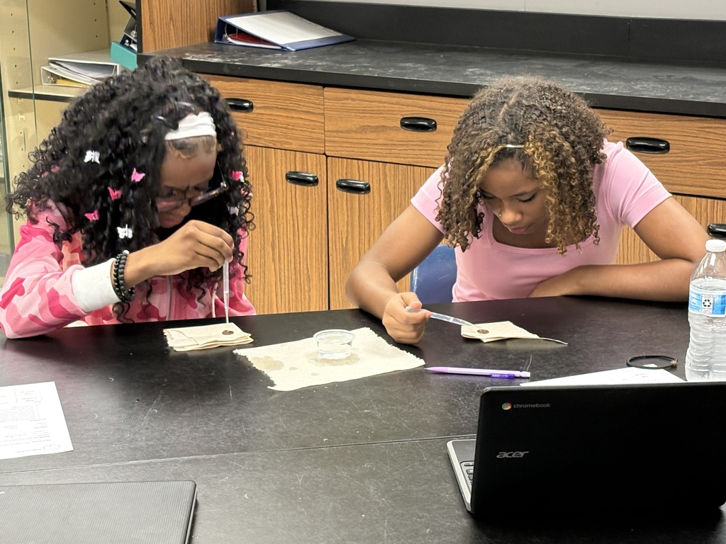 two girls using a dropper