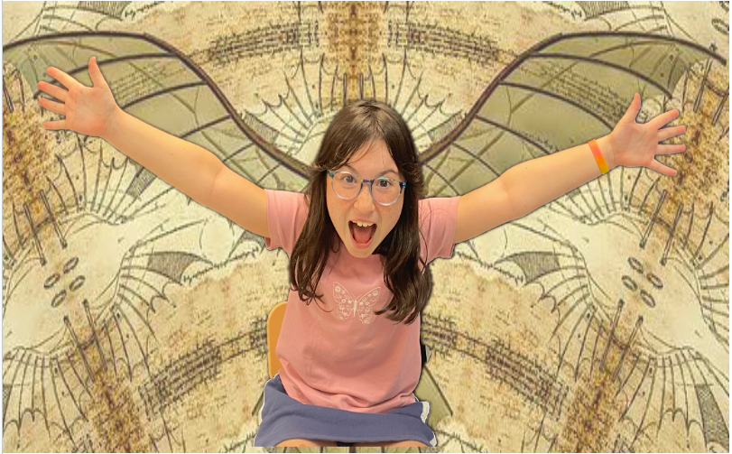 A girl with glasses and a pink shirt, arms open wide, sits in front of a patterned background.